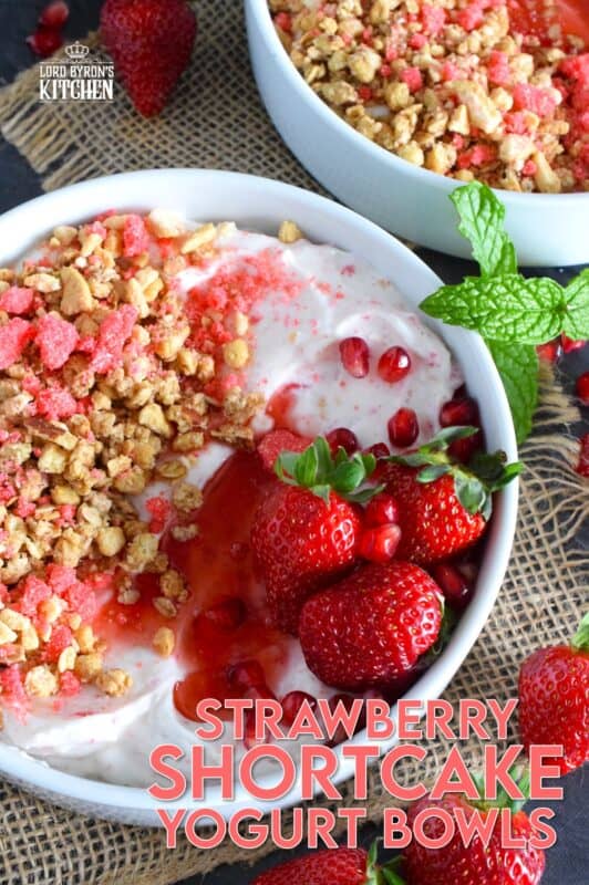Strawberry shortcake crumbs are stirred into Greek yogurt and then topped with fresh strawberries, more shortcake crumbs, a drizzle of homemade quick and easy strawberry syrup, and a little granola for added crunch and flavour. Strawberry Shortcake Yogurt Bowls make a great summer Sunday brunch menu option! #strawberry #shortcake #crumbs #yogurt #bowls #brunch #summer