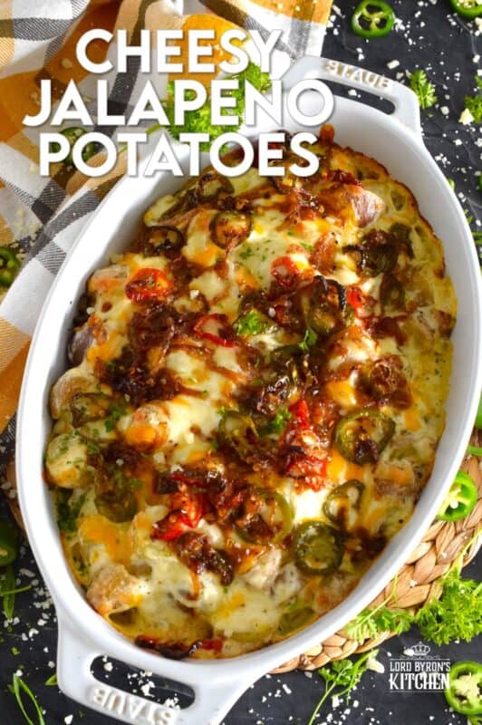 Cheesy Jalapeno Potatoes just might be my new obsession! Baby potatoes are tossed with seasonings, sour cream, and cheese and then transferred to a baking dish. Topped with caramelized onion and jalapenos, the potatoes are baked until browned and bubbly. These are simply amazing! #potatoes #cheesy #jalapenos #sourcream #bubbly #side