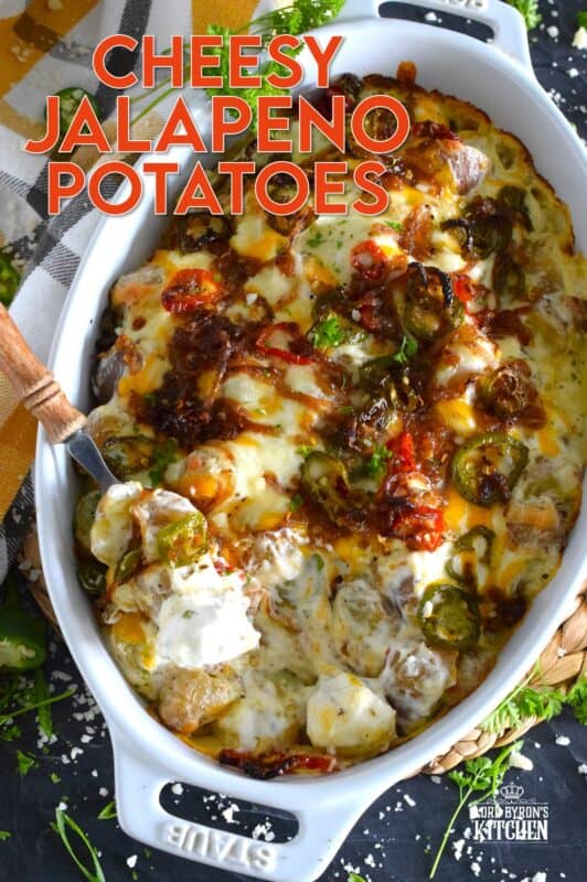 Cheesy Jalapeno Potatoes just might be my new obsession! Baby potatoes are tossed with seasonings, sour cream, and cheese and then transferred to a baking dish. Topped with caramelized onion and jalapenos, the potatoes are baked until browned and bubbly. These are simply amazing! #potatoes #cheesy #jalapenos #sourcream #bubbly #side