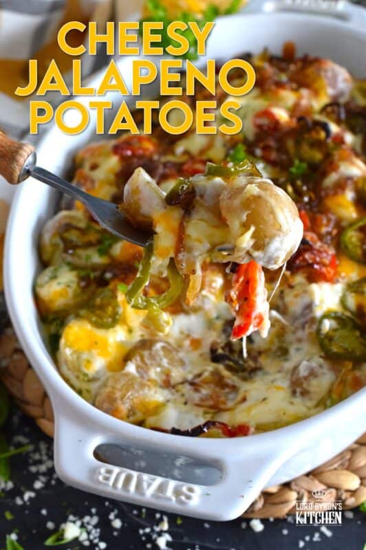 Cheesy Jalapeno Potatoes just might be my new obsession! Baby potatoes are tossed with seasonings, sour cream, and cheese and then transferred to a baking dish. Topped with caramelized onion and jalapenos, the potatoes are baked until browned and bubbly. These are simply amazing! #potatoes #cheesy #jalapenos #sourcream #bubbly #side
