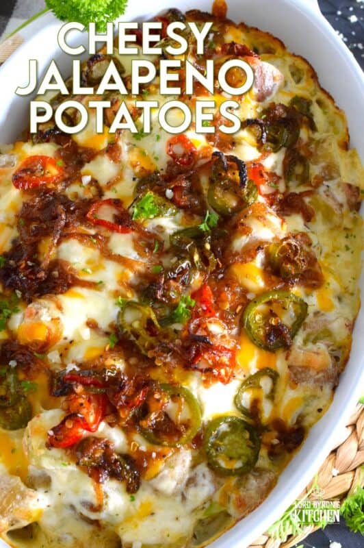 Cheesy Jalapeno Potatoes just might be my new obsession! Baby potatoes are tossed with seasonings, sour cream, and cheese and then transferred to a baking dish. Topped with caramelized onion and jalapenos, the potatoes are baked until browned and bubbly. These are simply amazing! #potatoes #cheesy #jalapenos #sourcream #bubbly #side