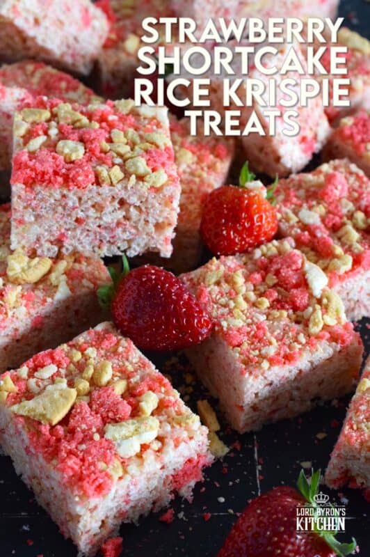 Strawberry Shortcake Rice Krispie Treats are loaded with those nostalgic pink and white cookie crumbs we all love! This no-bake confection is a favourite among kids both young and old, and they are easy to prepare and fun to eat too. These treats can also be prepared with vegan marshmallows if you have any dietary restrictions. #strawberry #shortcake #crumbs #ricekrispie #treats #squares #valentine #pink