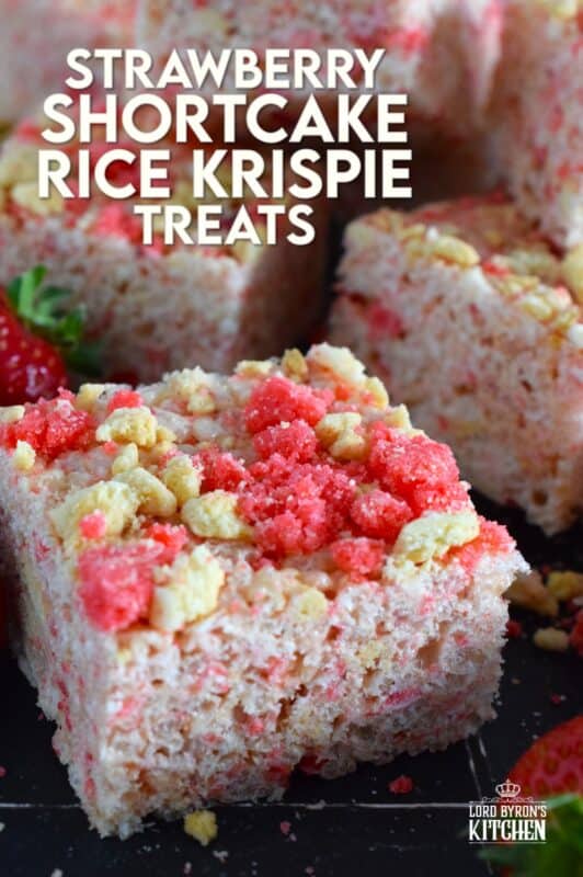 Strawberry Shortcake Rice Krispie Treats are loaded with those nostalgic pink and white cookie crumbs we all love! This no-bake confection is a favourite among kids both young and old, and they are easy to prepare and fun to eat too. These treats can also be prepared with vegan marshmallows if you have any dietary restrictions. #strawberry #shortcake #crumbs #ricekrispie #treats #squares #valentine #pink