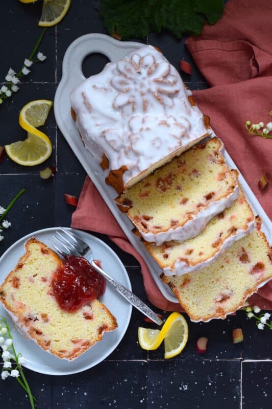 Prepared with lots of fresh rhubarb, this moist and delicious, lemony and refreshing loaf is drizzled with a sweet sugary glaze. Glazed Rhubarb Loaf is a perfect dessert or a lovely addition to your afternoon tea. This is a late-spring brunch item that doubles as an evening after-dinner dessert. #loaf #bread #cake #rhubarb #fresh