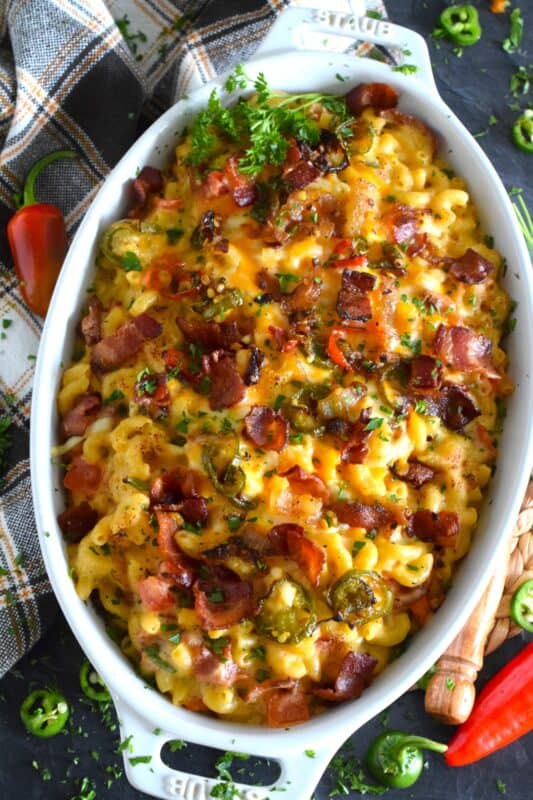 Macaroni and Cheese is always good even when it's bad, but you haven't tasted good until you've feasted on this Jalapeno Popper Mac and Cheese! Not only is it the cheesiest and creamiest, but it's also loaded with jalapenos, crispy bacon, fresh green onions, and chopped tomatoes too! #macandcheese #macaroni #cheese #jalapeno #jalapenopopper