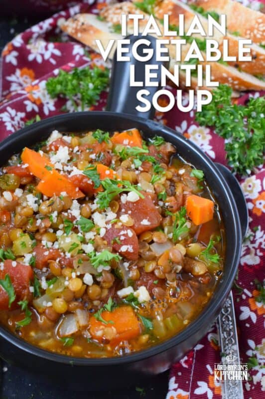 Italian Vegetable Lentil Soup is in fact more like a stew than a soup! It has a homestyle tomato flavour combined with the heartiness of tender, cooked lentils, and is paired with lots of fresh and good-for-you vegetables too. Top with grated parmesan and serve with crusty bread! #lentils #vegetable #soup #italian #parmesan