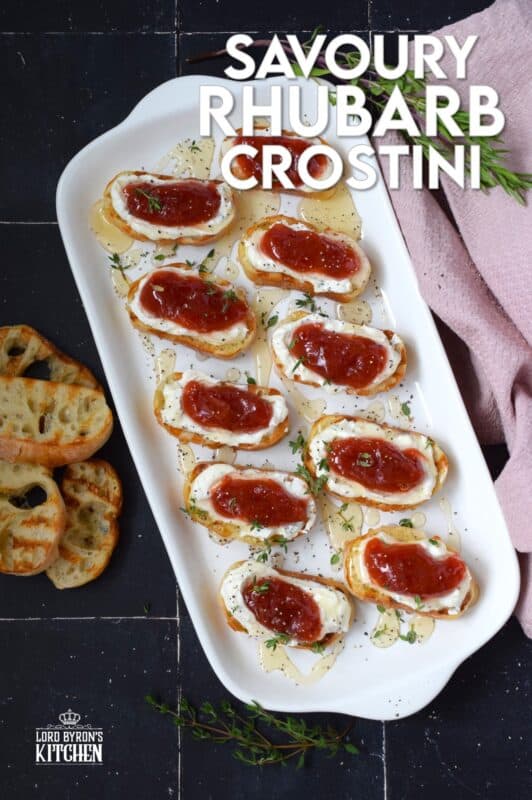 Spread with sweetened whipped cream cheese and topped with a homemade compote, this Savoury Rhubarb Crostini makes a lovely breakfast or brunch as well as a deliciously mouth-watering appetizer. Drizzle with honey and a sprinkling of fresh herbs for best results! #rhubarb #crostini #compote #appetizer