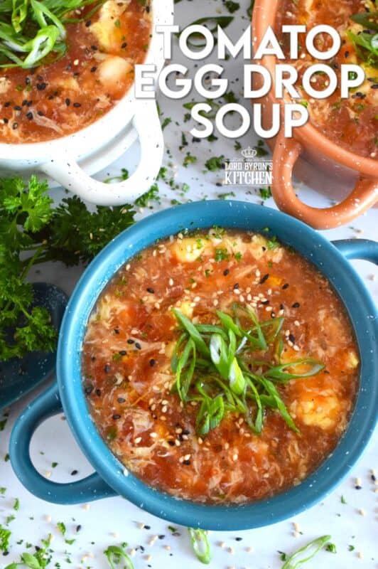 This quick and easy savoury Tomato Egg Drop Soup is prepared from start to finish in about 20 minutes! Better than the soup they serve at your favourite Chinese restaurant, and with an optional splash of hot sauce, the cozy and warm soup is hearty and healthy too! #asian #soup #eggdrop #vegetarian #eggs