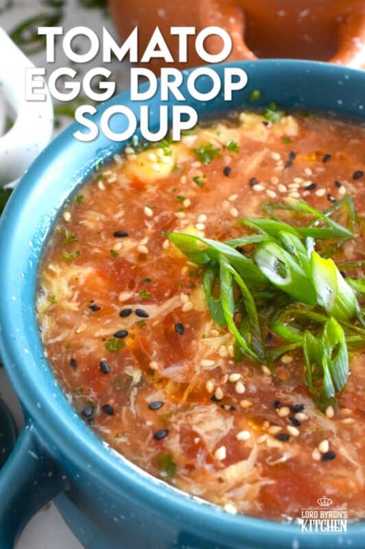 This quick and easy savoury Tomato Egg Drop Soup is prepared from start to finish in about 20 minutes! Better than the soup they serve at your favourite Chinese restaurant, and with an optional splash of hot sauce, the cozy and warm soup is hearty and healthy too! #asian #soup #eggdrop #vegetarian #eggs