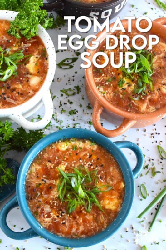 This quick and easy savoury Tomato Egg Drop Soup is prepared from start to finish in about 20 minutes! Better than the soup they serve at your favourite Chinese restaurant, and with an optional splash of hot sauce, the cozy and warm soup is hearty and healthy too! #asian #soup #eggdrop #vegetarian #eggs