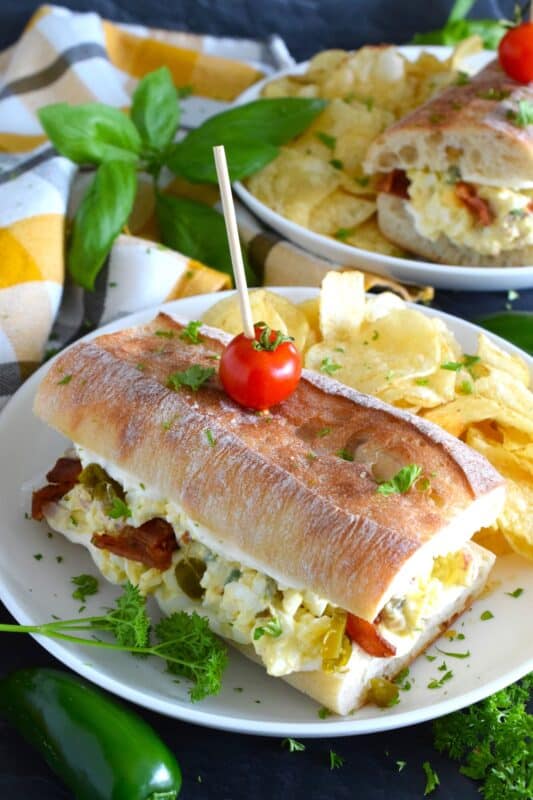 This is the most delicious and interesting egg salad sandwich you’ll ever eat! It is super flavourful and filled with freshness too. Jalapeno Popper Egg Salad Sandwiches are overfilled with egg salad that has been prepared with cheese, bacon, and pickled jalapenos! #jalapeno #popper #eggsalad #sandwiches