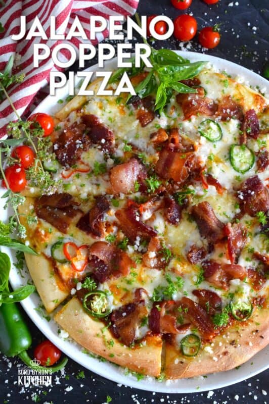 Shelf the tomato-based pizza sauce, because this Jalapeno Popper Pizza is not only prepared with an easy, homemade pizza dough, it's also made with a cream cheese spread. Loaded with lots of bacon, jalapenos, and mozzarella, this pizza is made to impress. Super flavourful with just the right amount of spice and heat, one slice is just a tease! #pizza #jalapeno #jalapenopopper #popper #homemade