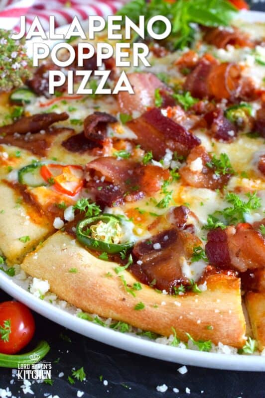 Shelf the tomato-based pizza sauce, because this Jalapeno Popper Pizza is not only prepared with an easy, homemade pizza dough, it's also made with a cream cheese spread. Loaded with lots of bacon, jalapenos, and mozzarella, this pizza is made to impress. Super flavourful with just the right amount of spice and heat, one slice is just a tease! #pizza #jalapeno #jalapenopopper #popper #homemade