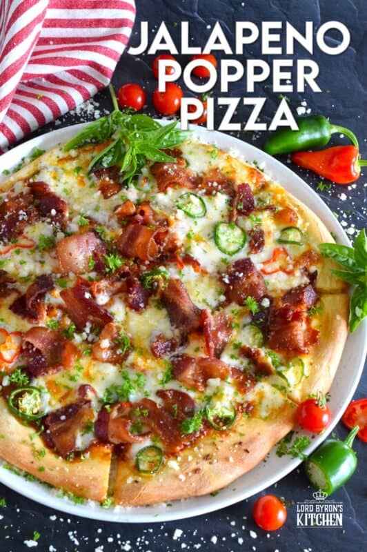 Shelf the tomato-based pizza sauce, because this Jalapeno Popper Pizza is not only prepared with an easy, homemade pizza dough, it's also made with a cream cheese spread. Loaded with lots of bacon, jalapenos, and mozzarella, this pizza is made to impress. Super flavourful with just the right amount of spice and heat, one slice is just a tease! #pizza #jalapeno #jalapenopopper #popper #homemade
