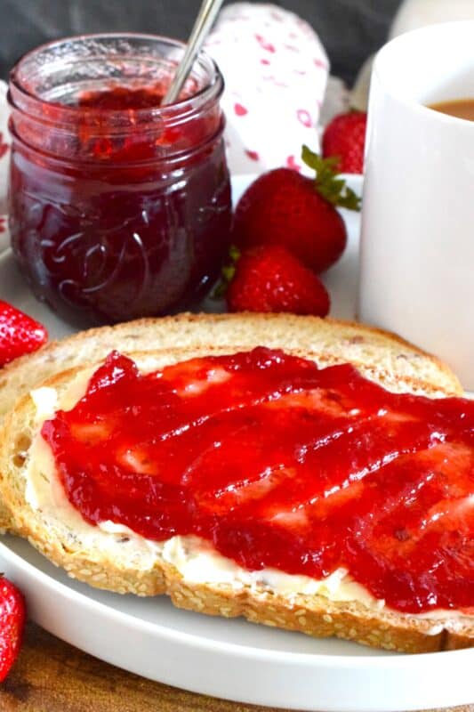 Prepared with summer fresh berries, sugar, and water, Seedless Red Currant Jam is one of my favourite ways to preserve those juicy, red berries! This recipe is very easy and you can easily reduce the number of jars it makes by dividing the ingredient amounts. Additionally, if you don't mind jam with seeds, you can skip the straining part! #redcurrant #currants #seedless #jam #jelly